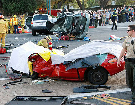 Police and firefighters respond to a fatal car accident in La Canada Flintridge, Calif. about 10 miles north of downtown Los Angeles.